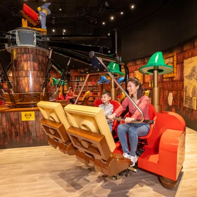Merlin's Apprentice ride at Legoland Discovery Centre Hong Kong, capturing the enchanting atmosphere of the ride's magical potions chamber.